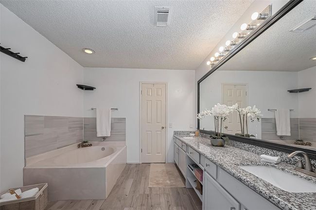 The large Primary Bath has a garden tub and a separate shower to enjoy | Image 5