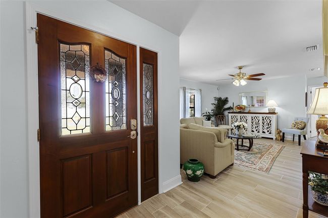 Inviting Foyer that leads to both the Living room and Family room | Image 4