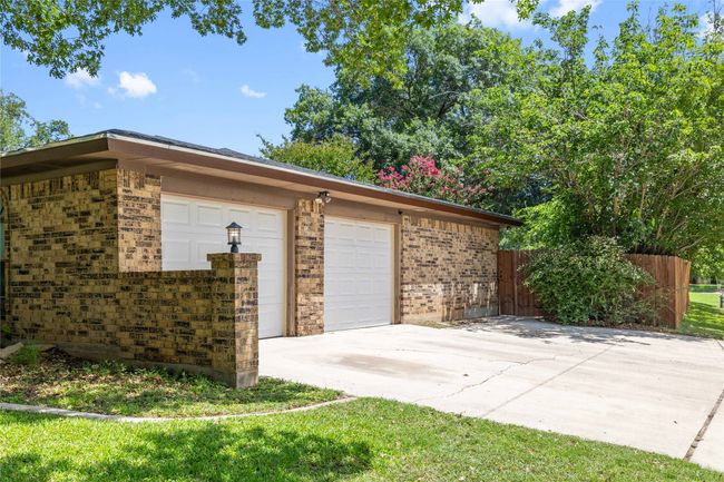 Garage with concrete driveway | Image 39