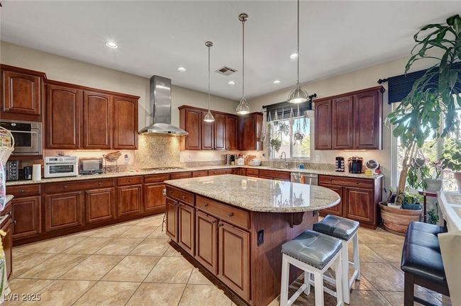 Entertainers Kitchen featuring stainless steel applainces and large island | Image 14