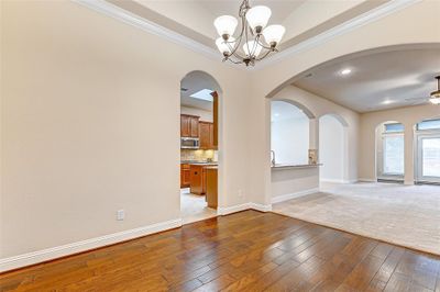 Located to the left of the foyer is your elegant dining room that is perfectly situated next to the kitchen and family room- perfect for entertaining and hosting guests! | Image 3