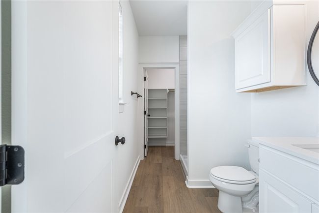 Bathroom with vanity, toilet, and hardwood / wood-style flooring | Image 26