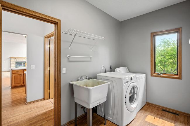 Don't miss the main level laundry! Here, you also access your two car garage. | Image 13