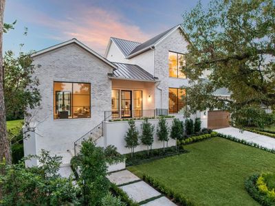 This stunning new construction home by Nest Luxury Homes is situated on an expansive 20, 190-square-foot lot in the prestigious River Oaks neighborhood. The vast, verdant lawn offers ample space for a pool or lush gardens, creating endless outdoor possibilities. A spacious loggia provides a perfect covered perch to relax and enjoy the serene surroundings. | Image 1