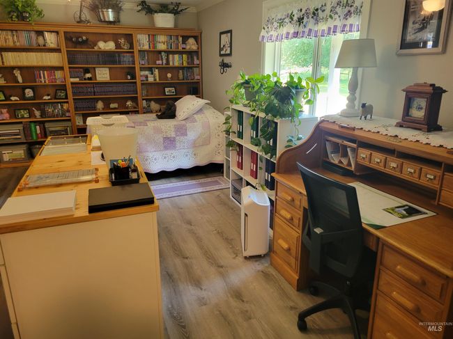 Office space with light wood-type flooring and crown molding | Image 30