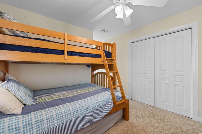 Bedroom featuring carpet flooring, a closet, and a ceiling fan | Image 25