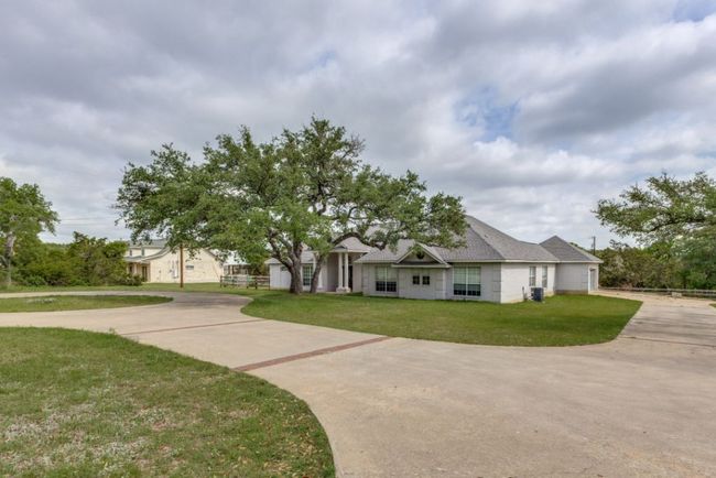 Craftsman-style house featuring driveway and a front yard | Image 4