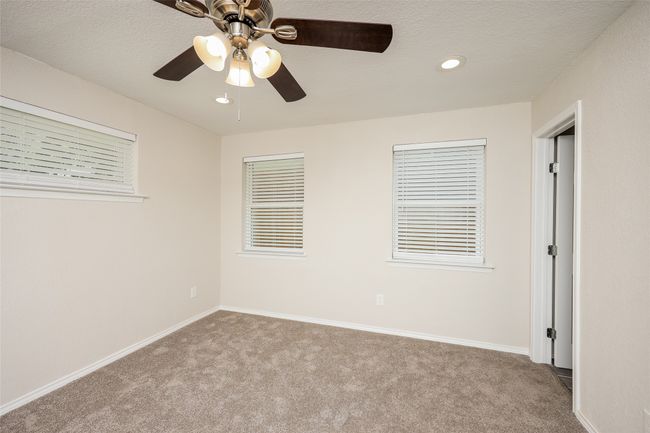 Unfurnished bedroom featuring carpet, recessed lighting, and ceiling fan | Image 13