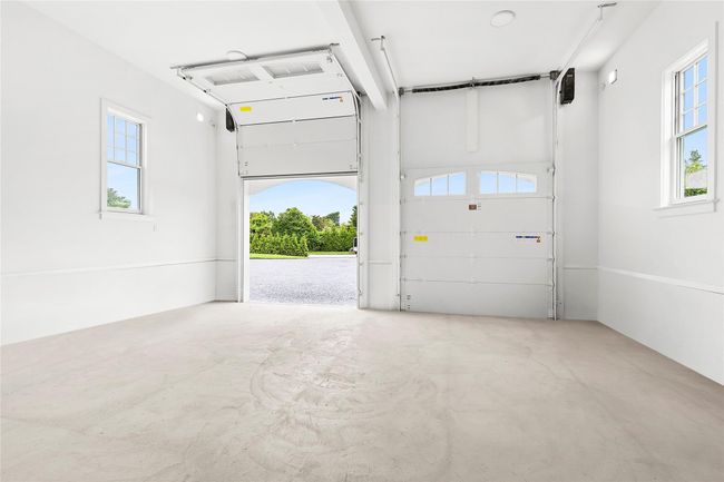View of garage with high ceilings, perfect for a car lift | Image 49