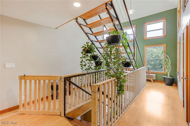 Corridor featuring wood finished floors, recessed lighting, and an upstairs landing | Image 19