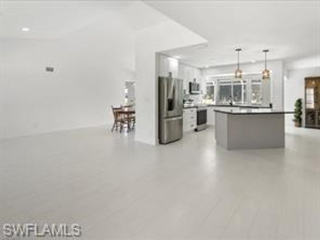 Kitchen with pendant lighting and appliances with stainless steel finishes | Image 6