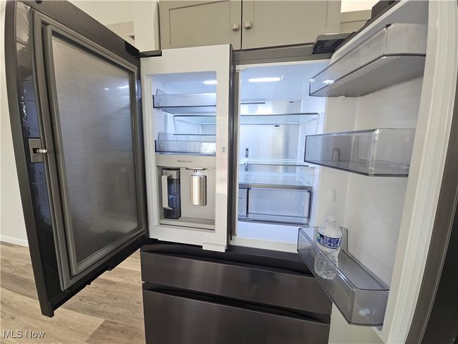 Front door opens to beverage center then again to refrigerator shelves, middle storage drawers can be frig or freezer use | Image 9