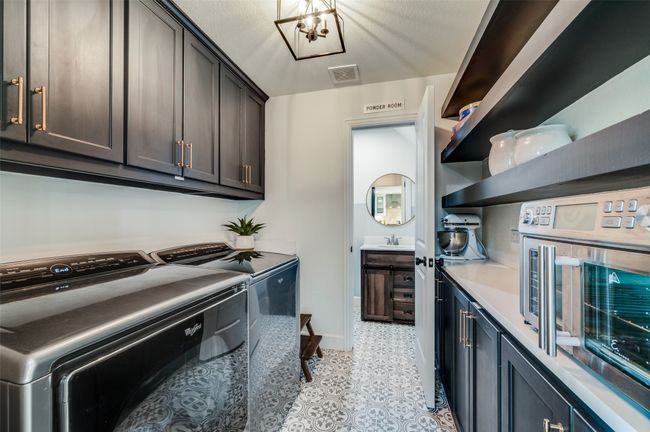Laundry room and powder bath! Lots of storage! | Image 18