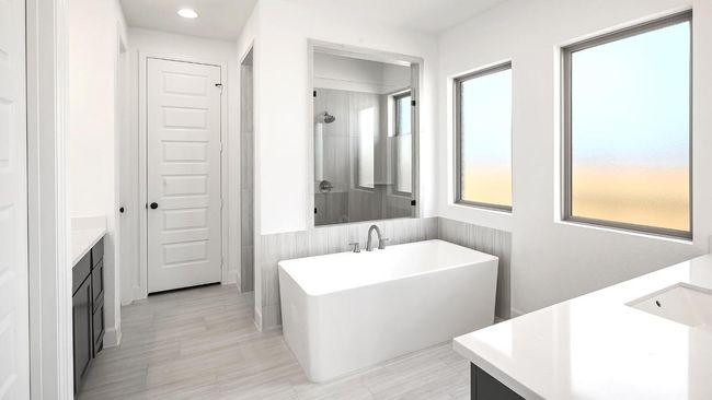 Bathroom featuring vanity, a freestanding bath, a shower, and recessed lighting | Image 11