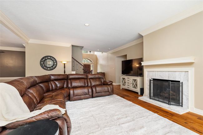 Whether you're hosting friends or settling in for a quiet evening, this inviting living room is designed to be the heart of the home—comfortable, elegant, and perfectly connected to everything you need. | Image 11