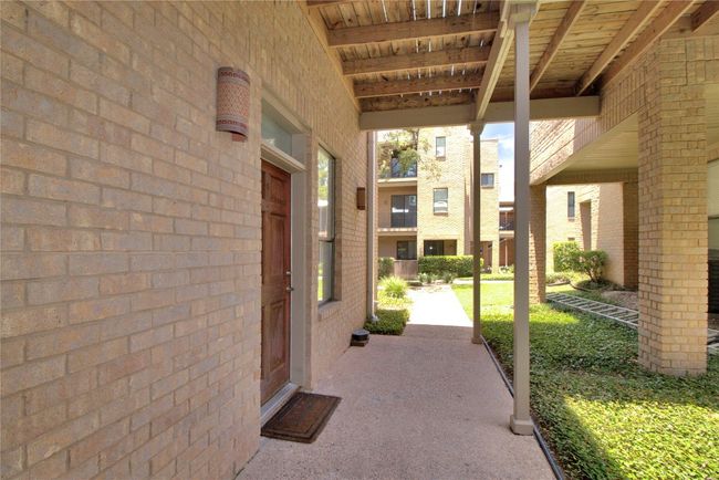 Covered walkway to unit #8. | Image 33