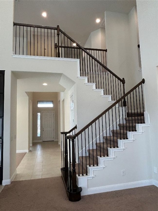 elegant stairs leading to the loft | Image 14