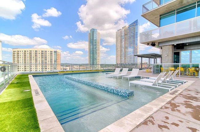 Community pool featuring a city view | Image 24