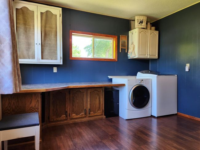 View as you enter from back door into spacious laundry/storage/office area. | Image 17