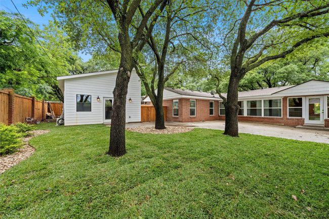 Rear view of property featuring a patio and brick siding | Image 31