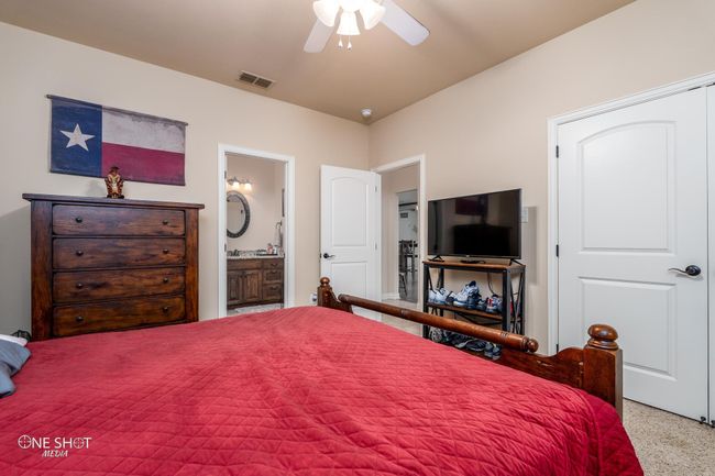 Bedroom featuring ensuite bathroom and a ceiling fan | Image 28