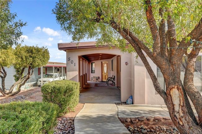 Entrance to property featuring stucco siding and a porch | Image 8