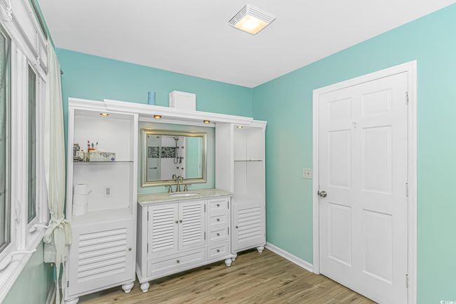 Bathroom featuring wood finished floors and vanity | Image 21
