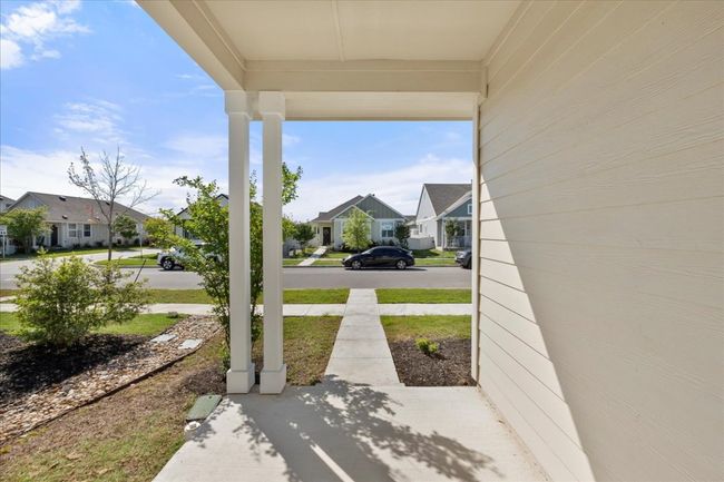 View of patio / terrace with a porch and a residential view | Image 5