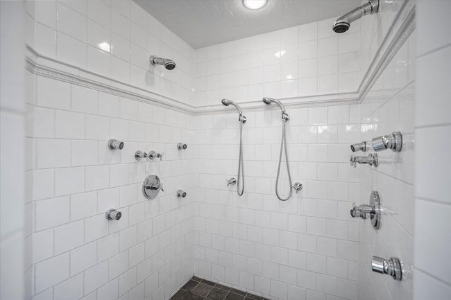 Bathroom featuring a tile shower | Image 35