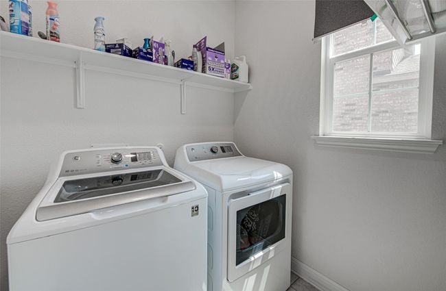 Laundry area with Shelves. Roller Shade Installed – First Floor | Image 15