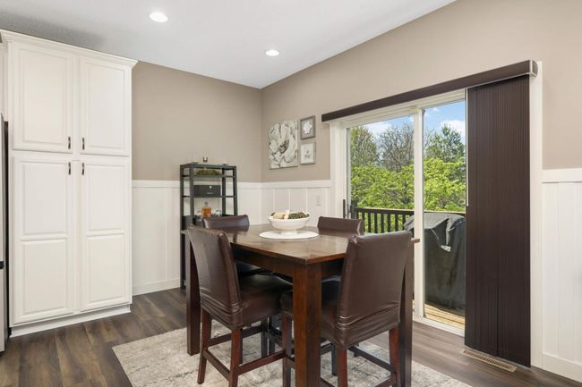 Eat in kitchen area with patio door to back deck | Image 7