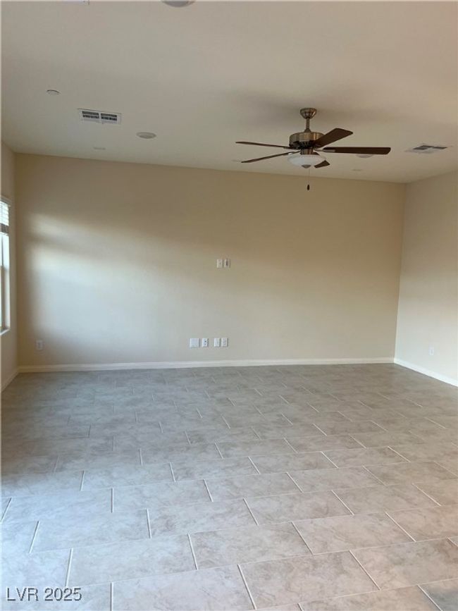 Unfurnished room featuring a ceiling fan and baseboards | Image 11