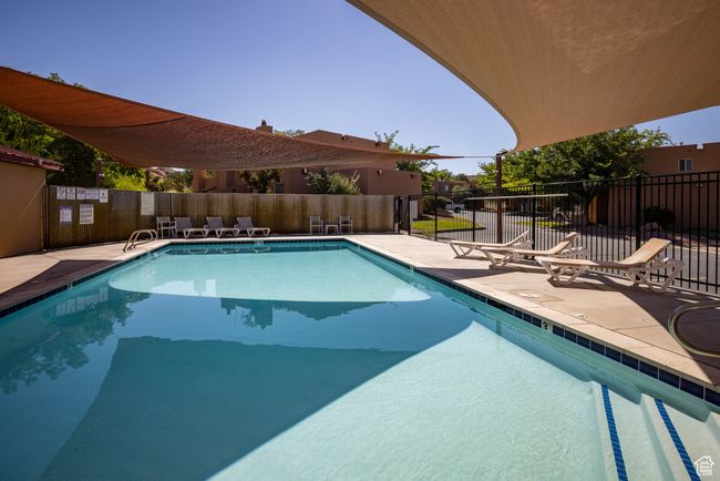 View of swimming pool featuring a patio area | Image 35