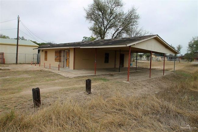 Back of house with a carport | Image 8