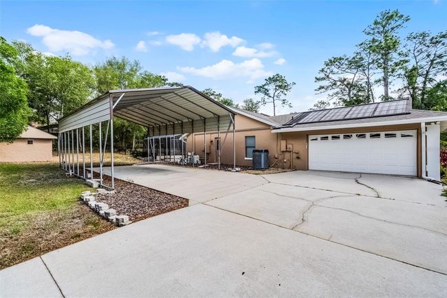 Side entry 2 car garage and RV carport | Image 31