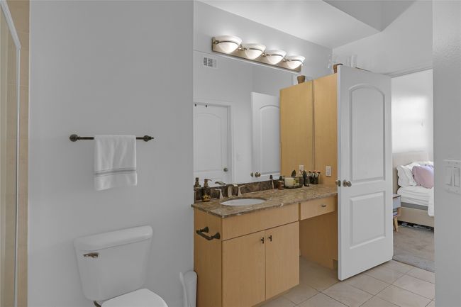 Bathroom with vanity, light tile patterned floors, and ensuite bathroom | Image 12