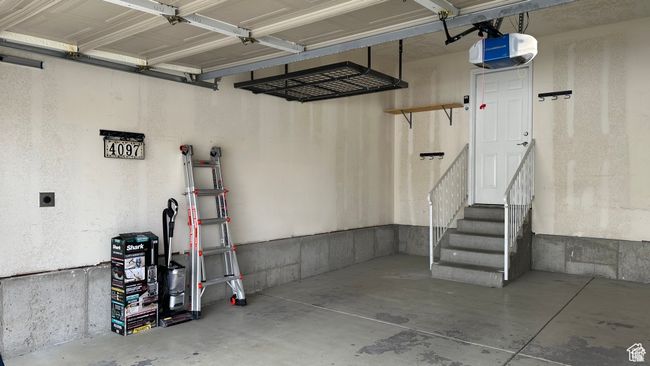 Garage with a garage door opener | Image 26