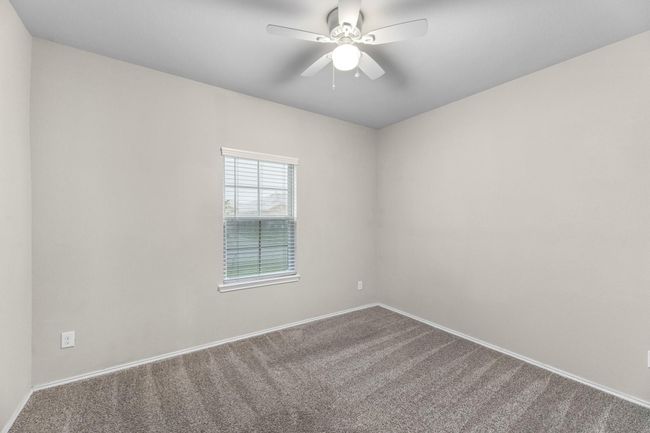 First bedroom has a view of the front yard. This room can easily be a private office/Study, Mother-in-law room, nursery, teen/college or guest room. | Image 11