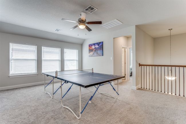 Game room with carpet and a ceiling fan | Image 12