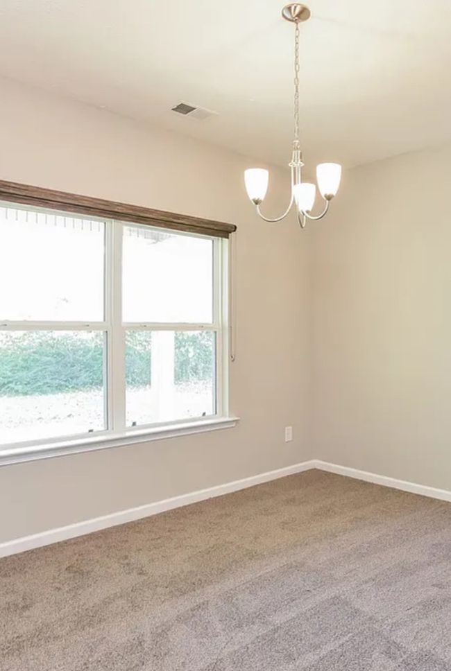 This room is just off the downstairs hallway. The large half bath is beside it. It could be an office or Rec Room area | Image 7