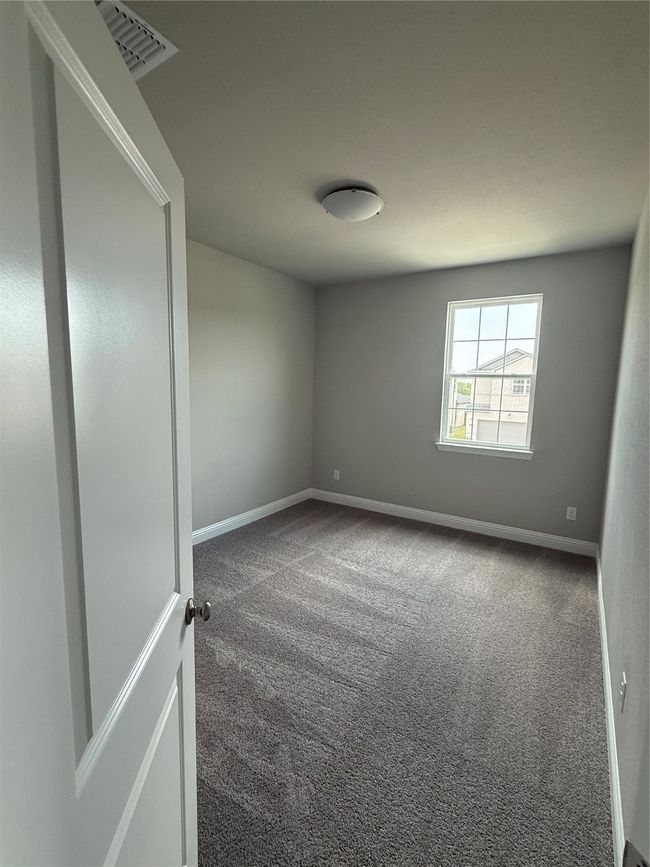 Carpeted empty room with baseboards | Image 20