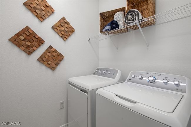 Laundry area featuring washer and clothes dryer and laundry area | Image 34