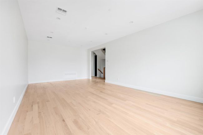 Spare room with light wood-type flooring | Image 19