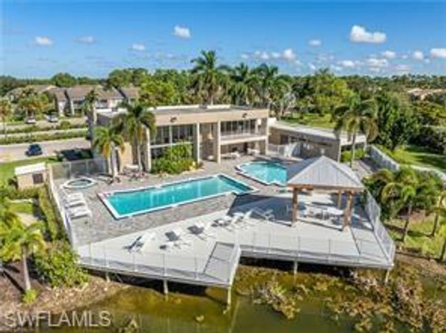 Community pool with a patio and a water view | Image 28