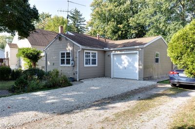 View of front facade with a garage | Image 1