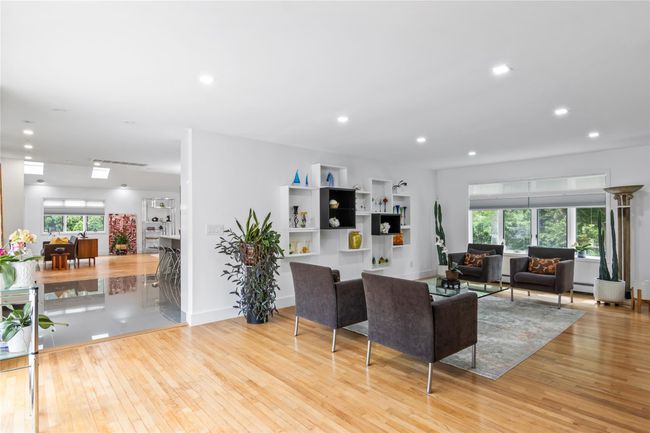 Living room featuring hardwood / wood-style flooring, recessed lighting, a baseboard radiator, and baseboards | Image 6