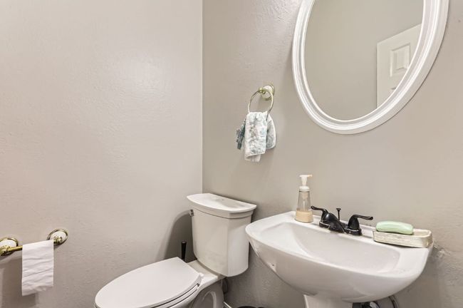 Half bath with a sink and toilet | Image 18