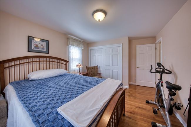 bedroom with hardwood floors | Image 20