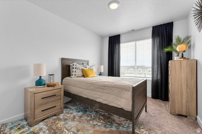 Bedroom featuring baseboards and light colored carpet | Image 11