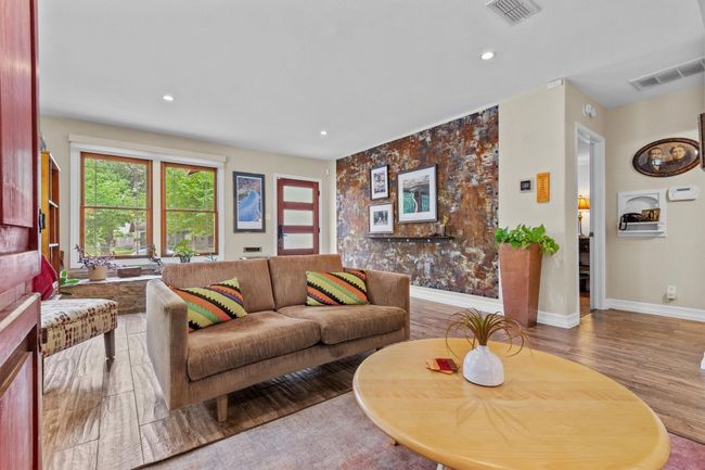 MAIN: View of lving room showing hall to primary bedroom | Image 6